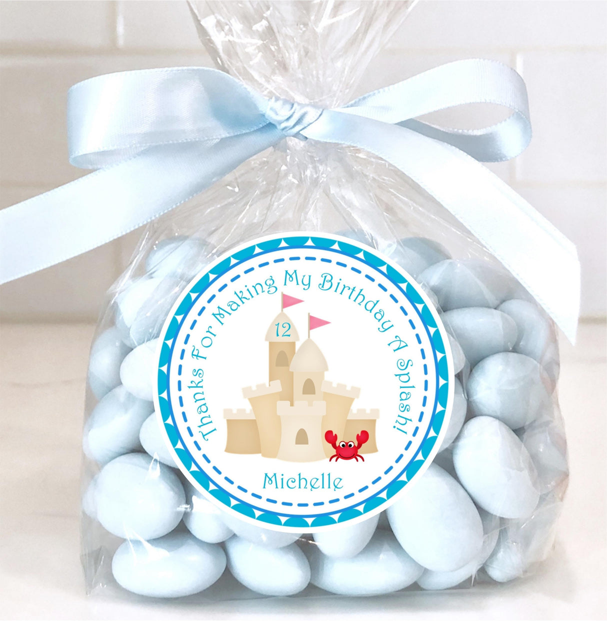 Beach birthday sticker featuring watercolor sandcastle design