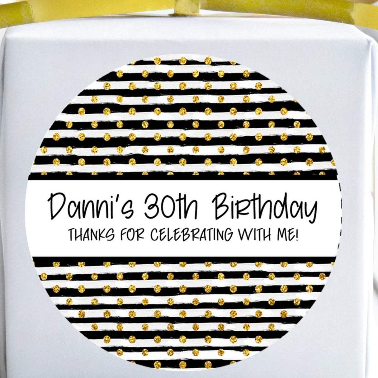 Black and gold striped birthday sticker with dotted accents