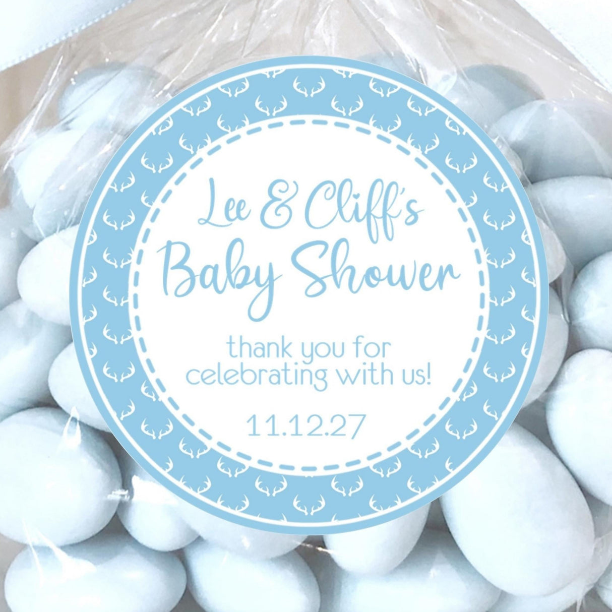 Blue deer baby shower stickers with white antler border design.