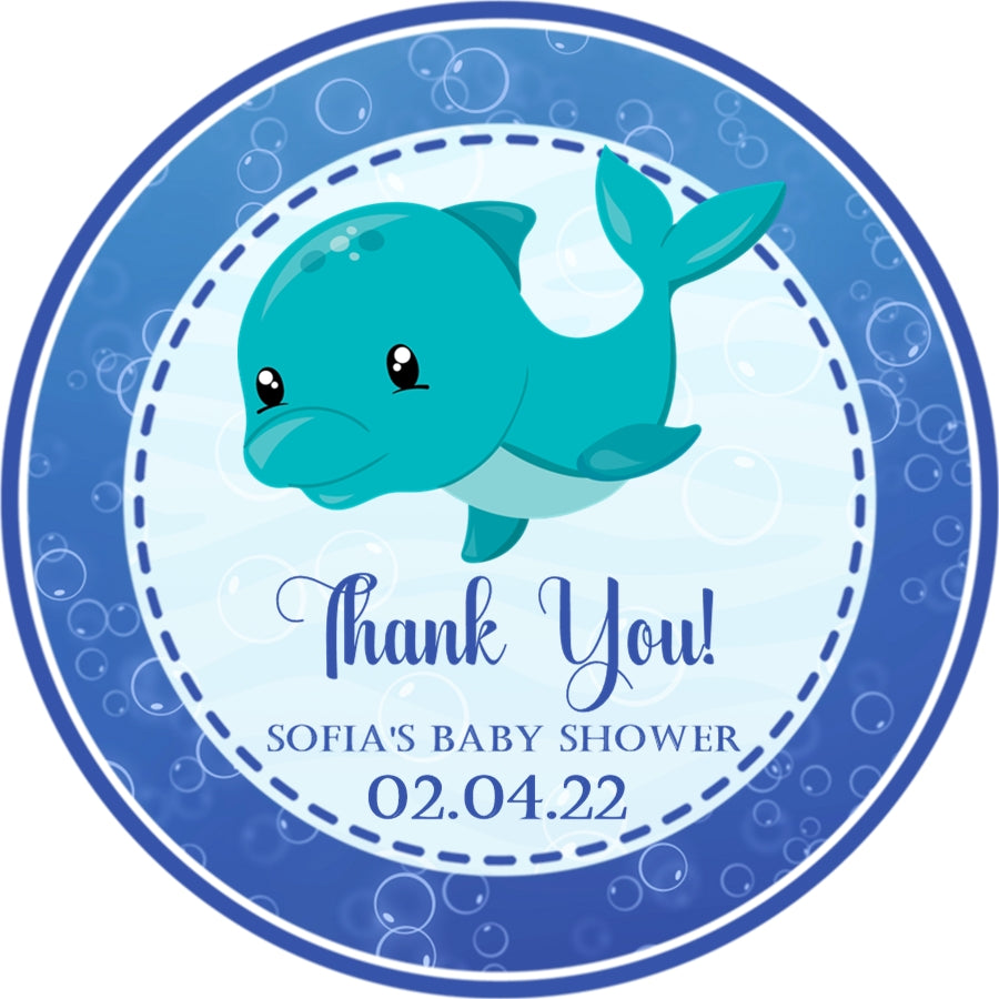 Blue whale baby shower sticker with underwater bubbles and wave background