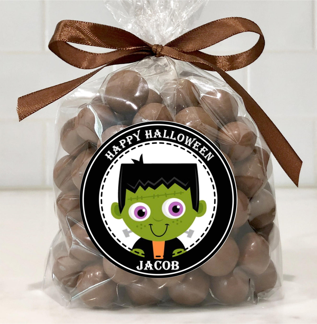 Cartoon Frankenstein head Halloween sticker with playful spooky design