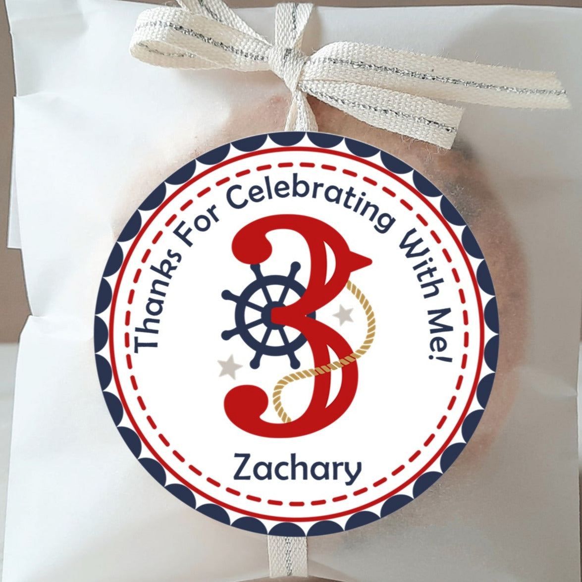 Nautical birthday sticker with red number and ship wheel