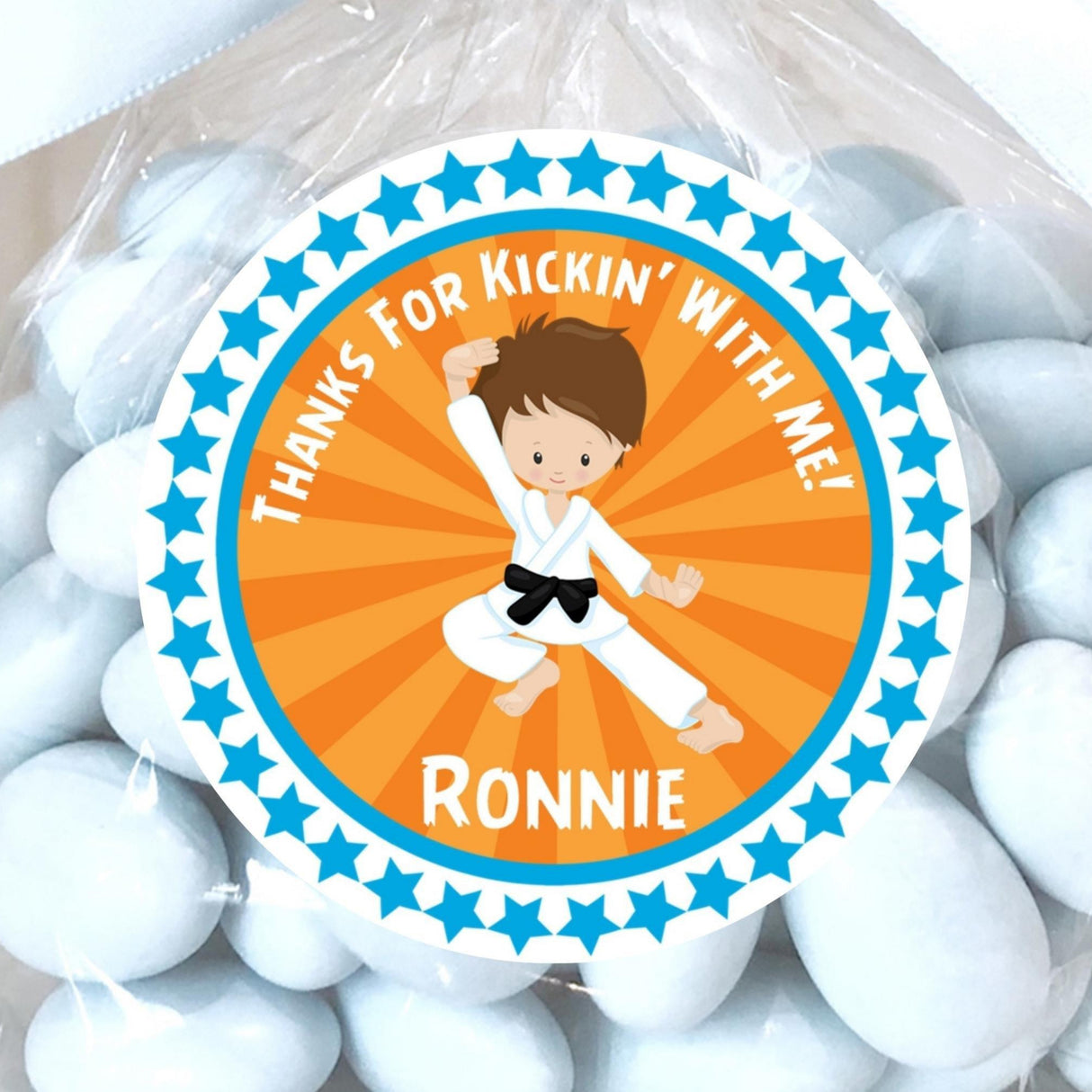 Orange karate boy sticker with martial arts jump pose