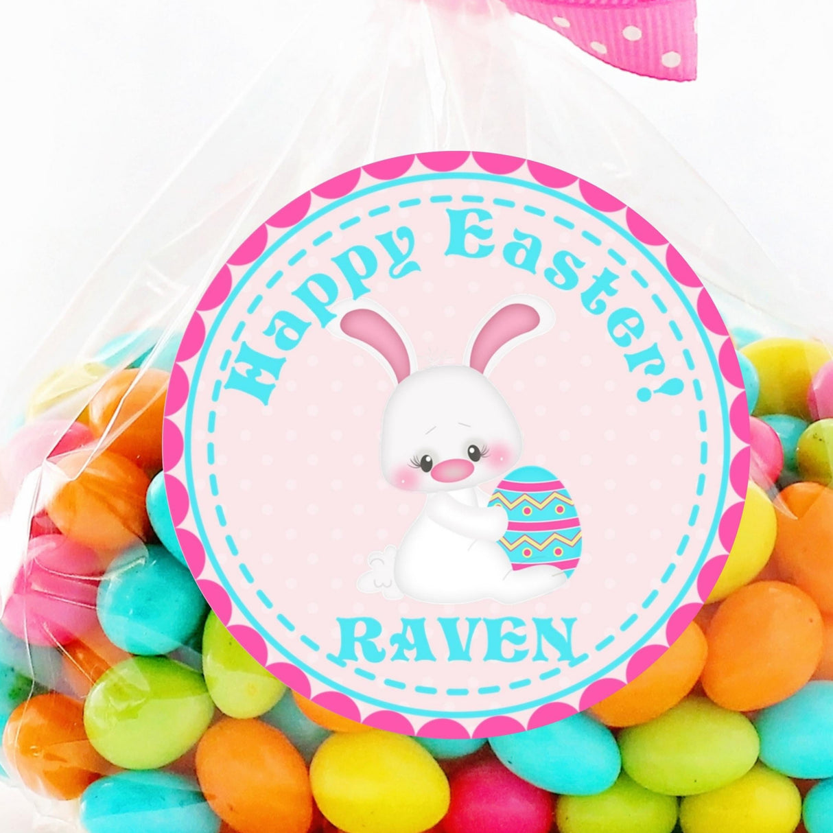 Pink Easter bunny sticker holding decorated egg