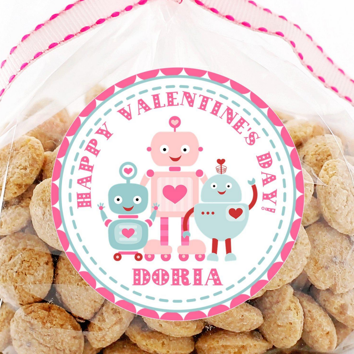 Pink robot Valentine sticker with three robots and heart accents