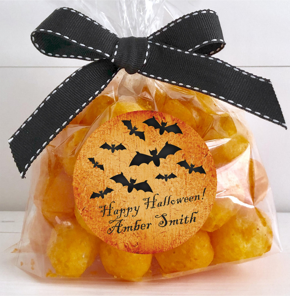 classic halloween party sticker with orange background and black bats