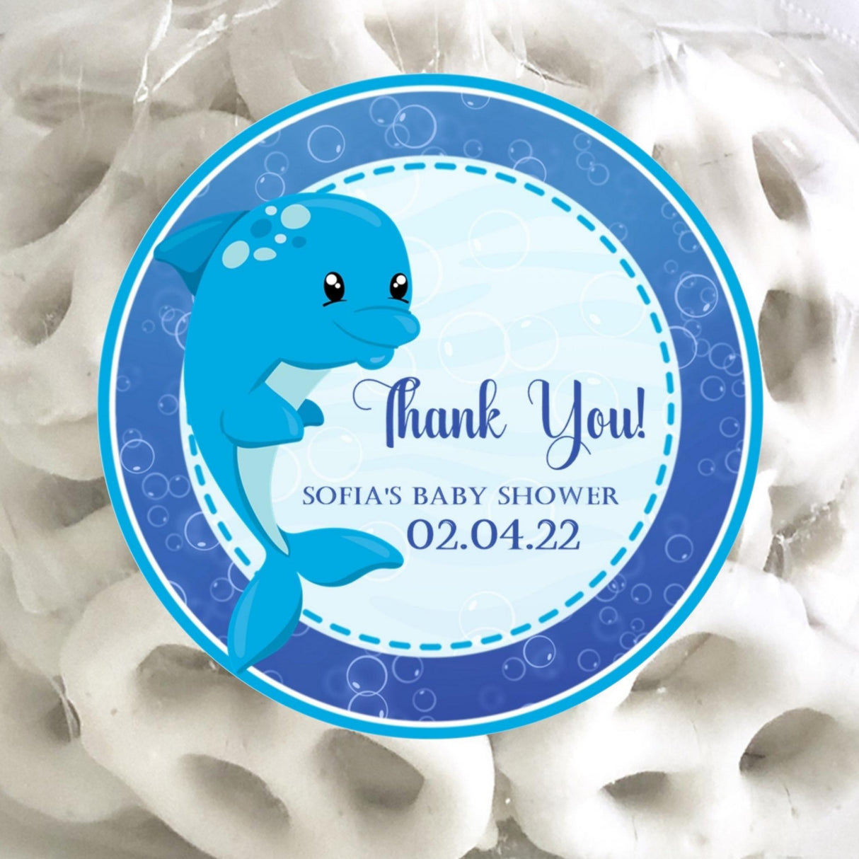 dolphin baby shower sticker with navy text and blue border