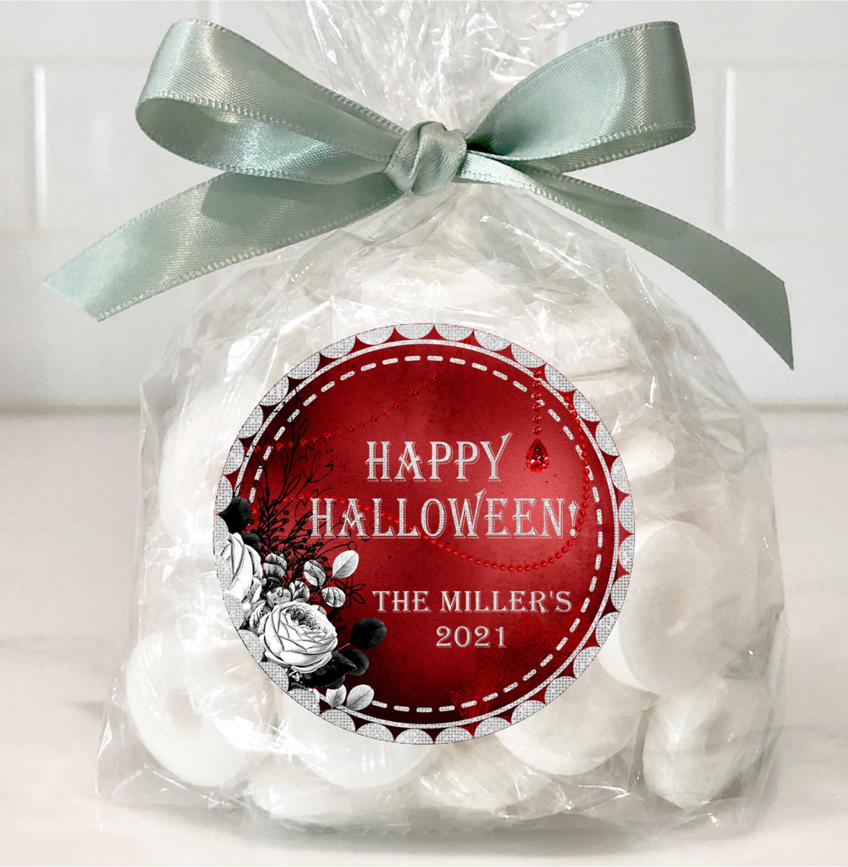 gothic style halloween party sticker with distressed red texture and florals