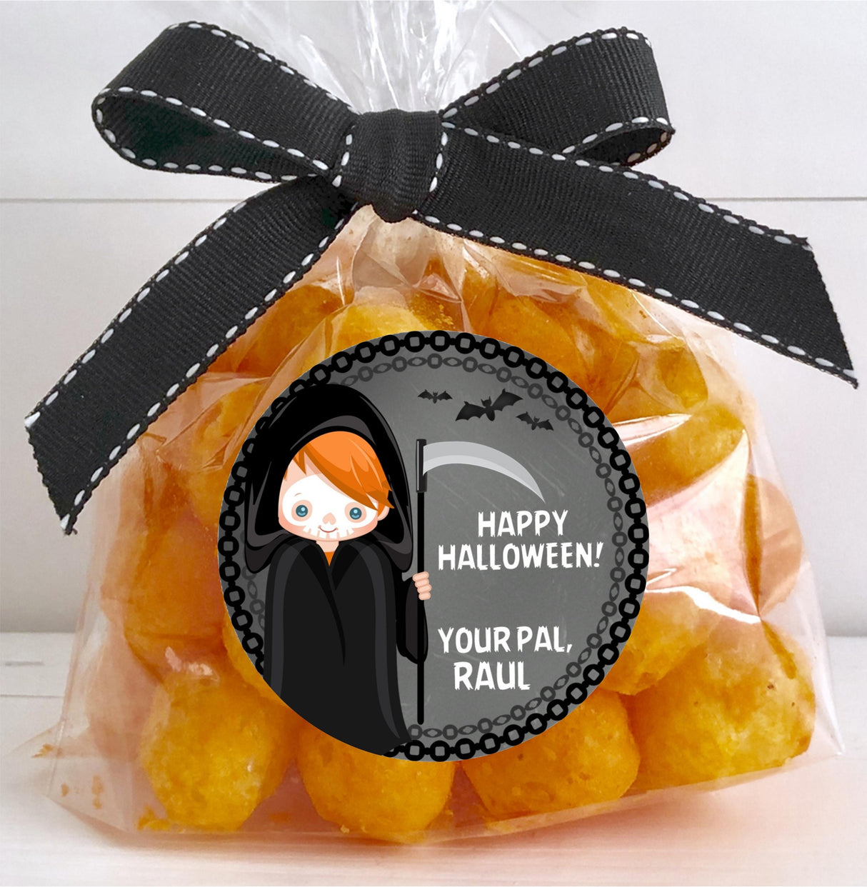 kids halloween party sticker featuring grim reaper character