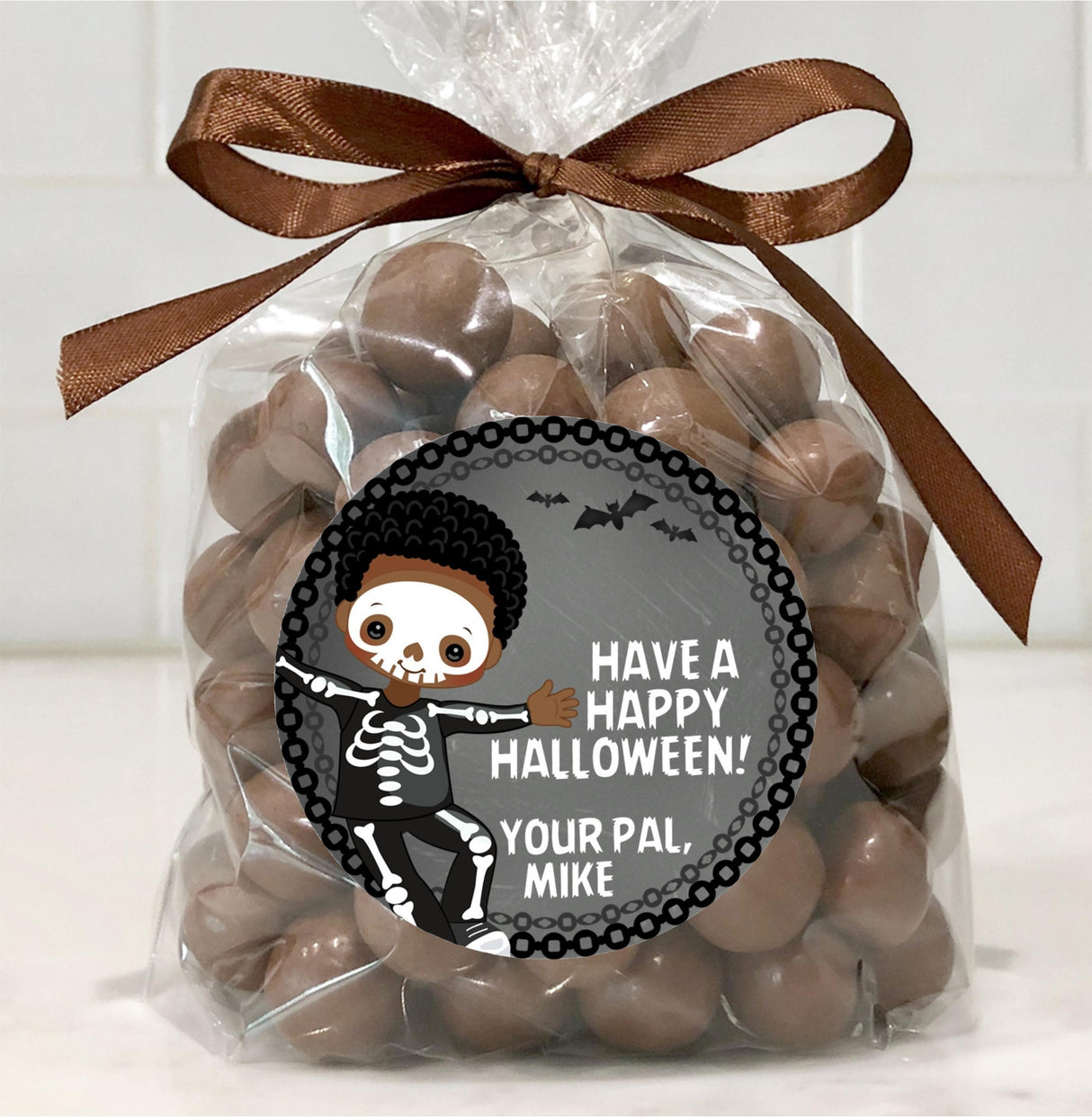 kids halloween party sticker featuring skeleton character