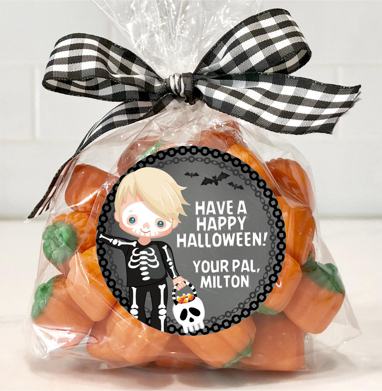 kids halloween party sticker with skeleton and candy design