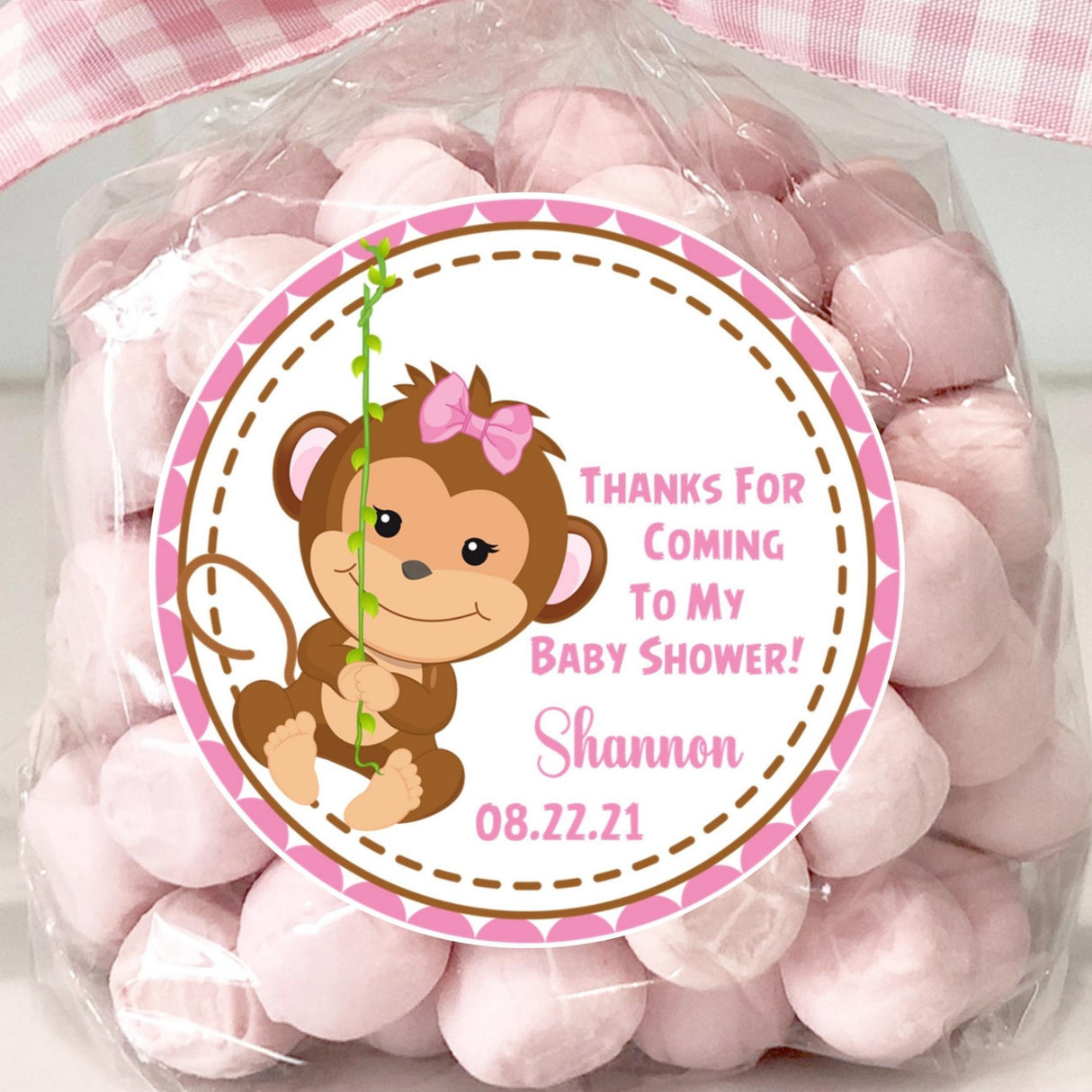 pink monkey baby shower sticker with monkey swinging from vine