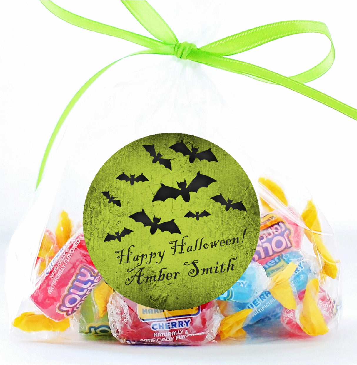 vintage style halloween sticker with green backdrop and bat design