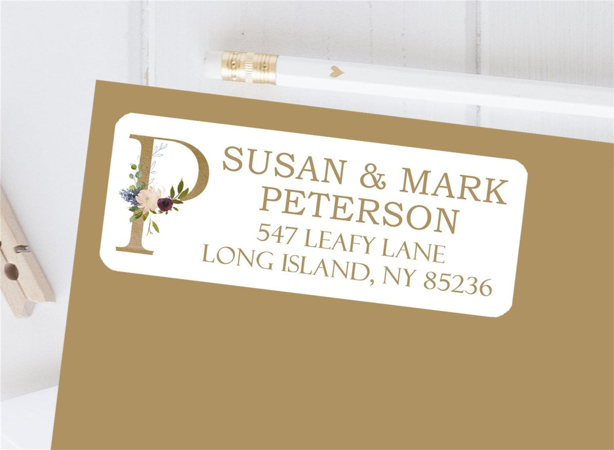 Gold initial floral personalized address label on envelope