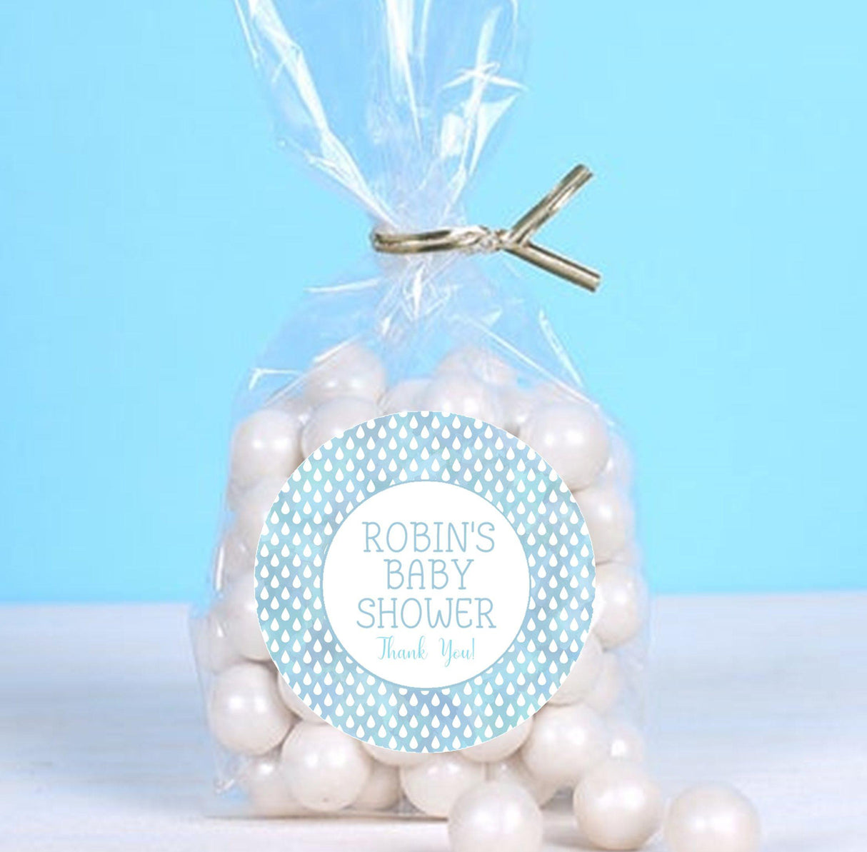 Personalized baby shower label with raindrop pattern