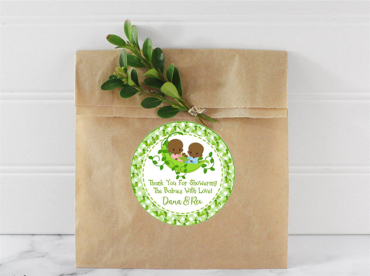 Personalized twin baby favor label featuring boy and girl twins