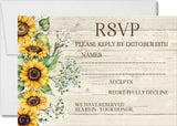 A rustic wedding RSVP card with a light wood plank background, watercolor sunflowers and green leaves.