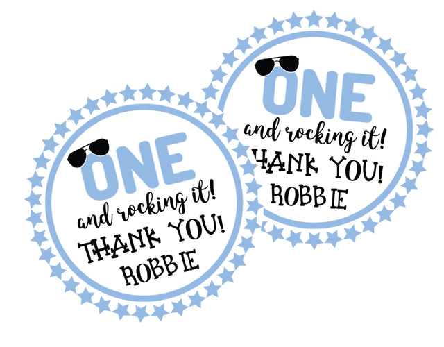 Blue “One and Rocking It” 1st birthday sticker with sunglasses