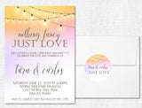 Blush and peach wedding invitation collection featuring illuminated string light artwork