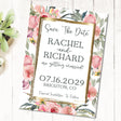Blush pink floral save the date card featuring watercolor roses, eucalyptus leaves, and a gold border.