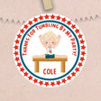 Boys gymnastics birthday sticker with red stars and gymnast on bench