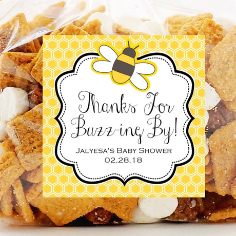 Bumble bee baby shower sticker with honeycomb pattern background