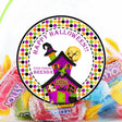 Colorful haunted house Halloween sticker with witchy potion shop and polka dot border