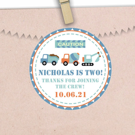 Construction birthday sticker with dump truck, mixer, and excavator