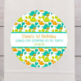 Cute dinosaur birthday sticker with teal and orange baby dinosaurs
