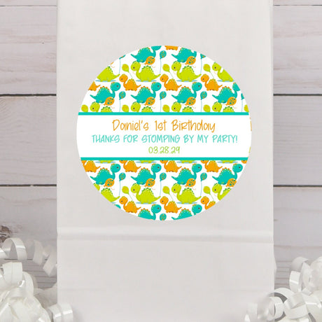 Cute dinosaur birthday sticker with teal and orange baby dinosaurs