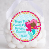 Dark-skinned mermaid birthday sticker with pink hair and teal fin