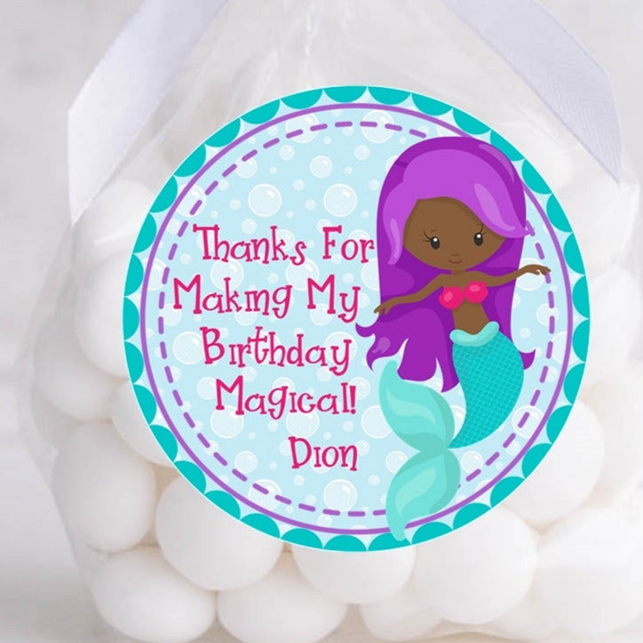 Dark-skinned mermaid birthday sticker with purple hair and teal fin