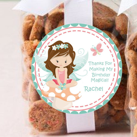 Fairy sitting on mushroom birthday sticker with personalized name.