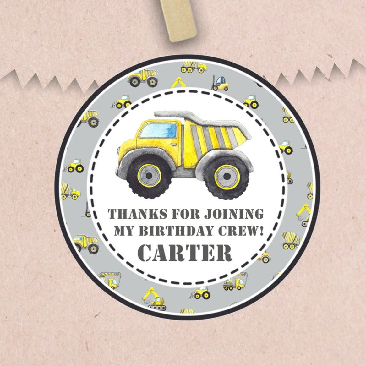 Gray construction birthday sticker with yellow dump truck and personalized name