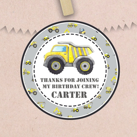 Gray construction birthday sticker with yellow dump truck and personalized name