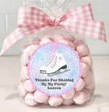 Ice skates party favor sticker in pink winter theme