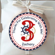 Nautical birthday sticker with red number and ship wheel