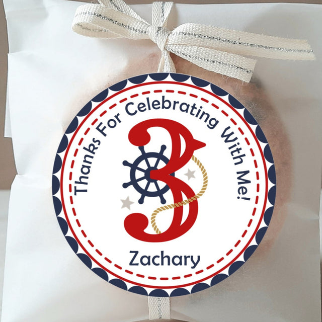 Nautical birthday sticker with red number and ship wheel