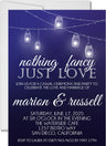 Navy blue wedding invitation featuring glowing bistro lights and romantic evening styling