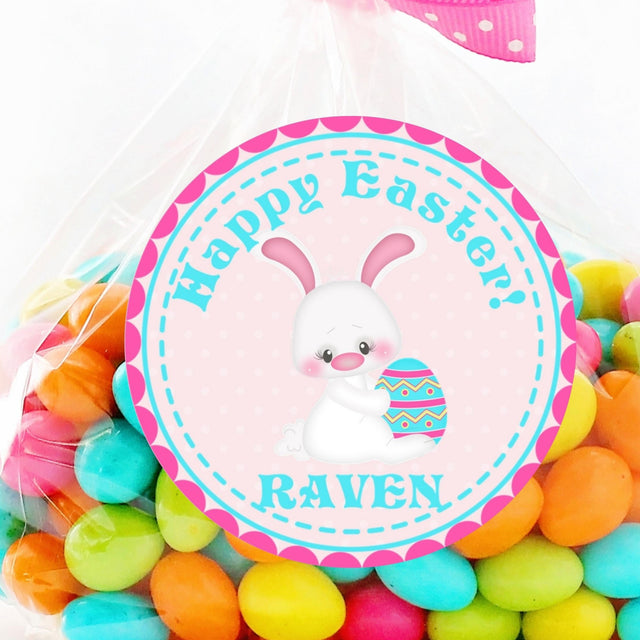 Pink Easter bunny sticker holding decorated egg