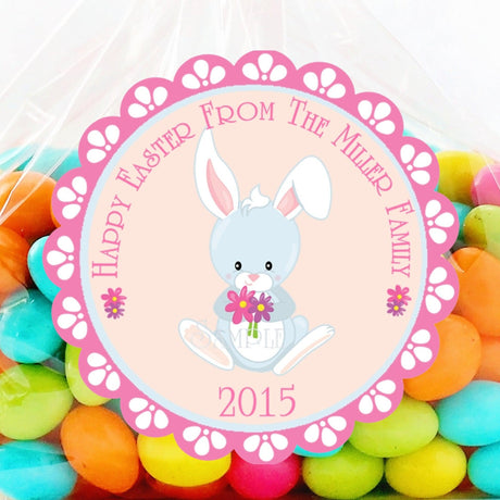 Pink Easter bunny sticker holding flowers with scalloped border