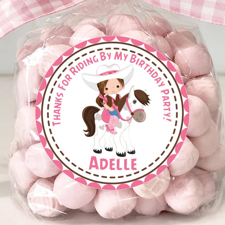 Pink cowgirl birthday sticker with girl riding white horse