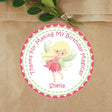 Pink petal fairy birthday sticker with green wings and personalized name.
