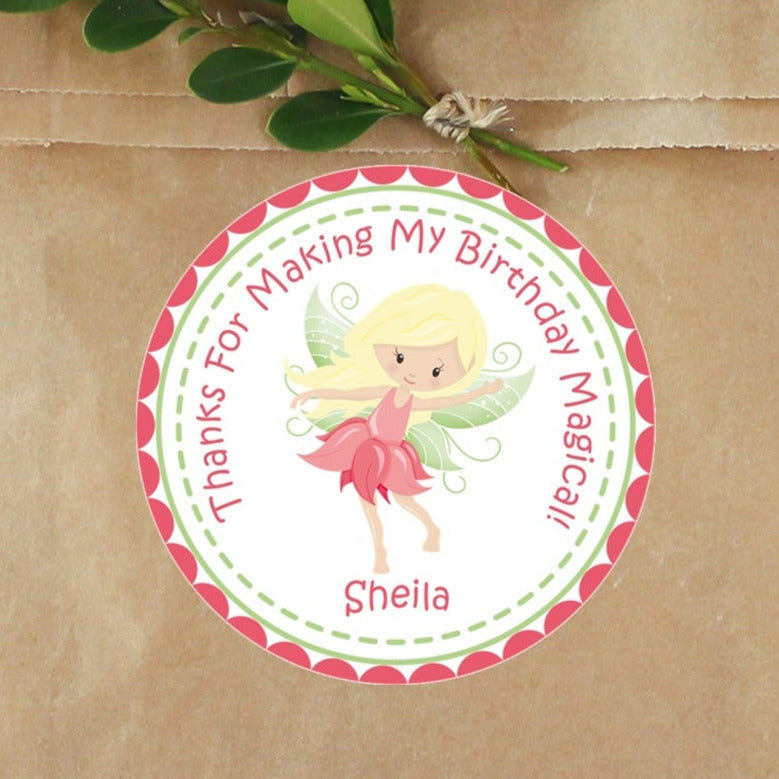 Pink petal fairy birthday sticker with green wings and personalized name.