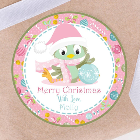 Pink sitting bird Christmas sticker with winter accessories