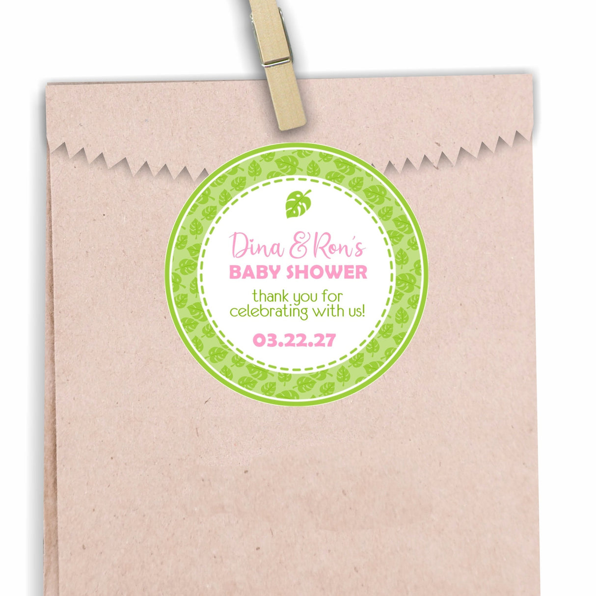 Pink tropical leaf baby shower sticker with green leaf background