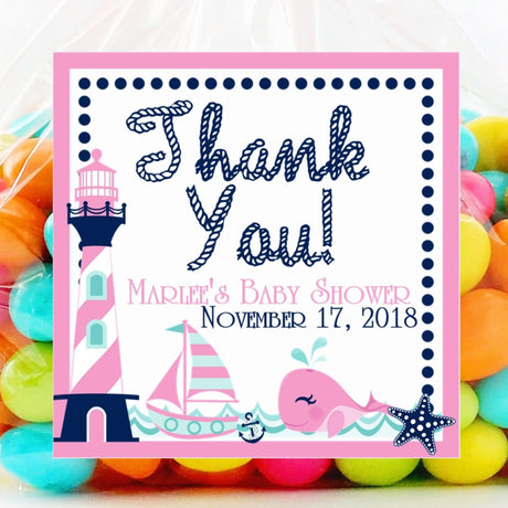 Pink whale baby shower sticker with lighthouse design
