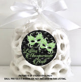 Round lime green masquerade birthday sticker on quilted black background