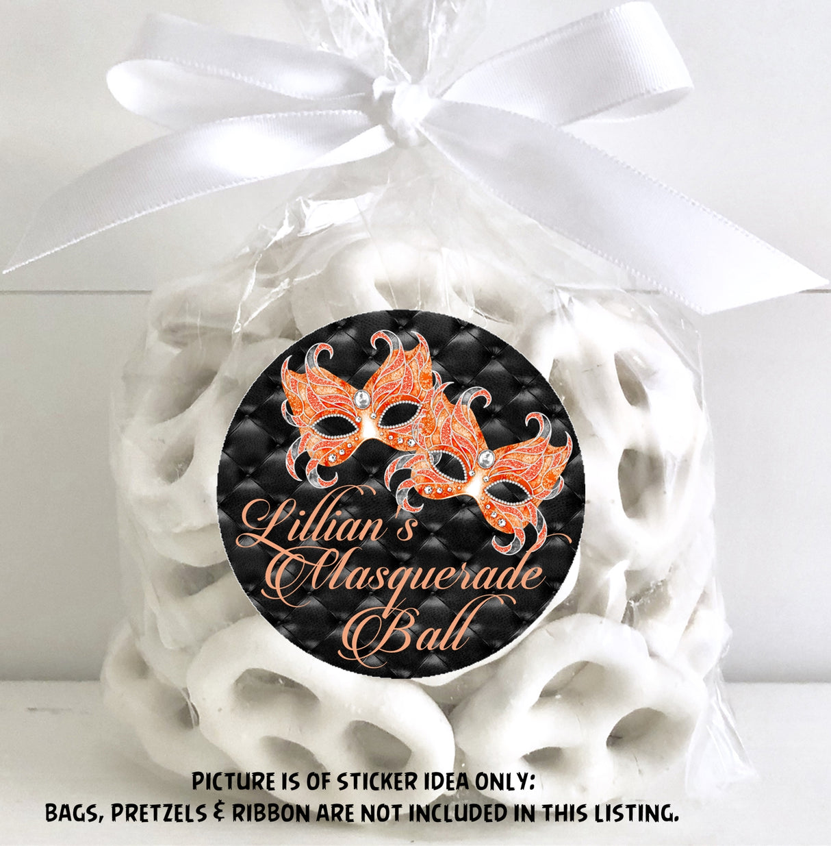 Round orange masquerade birthday sticker on quilted black background