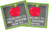 Square school supply labels featuring red apple illustrations
